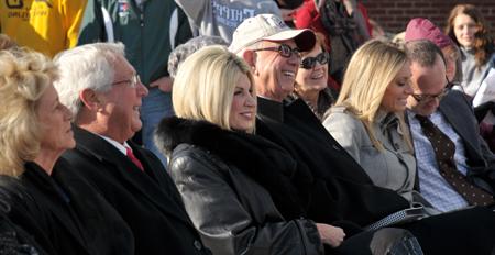 Dr. Larry and Beverly Noe laugh during the dedication of the  Alumni & Friends Park and Noe Plaza, named after his parents  James L. Noe Sr. and Louise B. Noe. At left are their daughter  Ashley with her husband Dr. David Meister. Taylor County  Judge/Executive Eddie Rogers and his wife Theresia are at right.  (CU Photo by Linda Waggener)